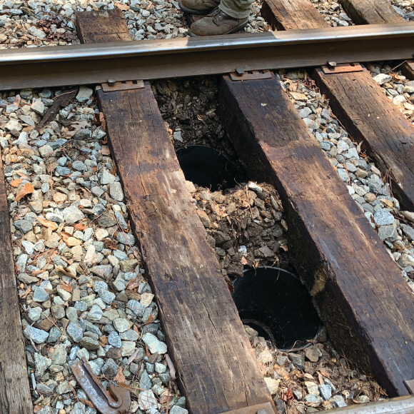 Close-up image of Geopier's GeoSpike system installed in the ground.